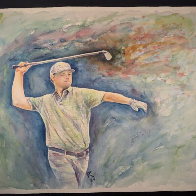 Professional golfer Patton Kizzire carefully evaluates the weight and swing speed of his golf club.