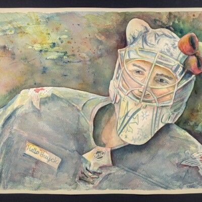 Connor Hellebuyck, goalie of the Winnipeg Jets and avid Sanrio fan, proudly displays his updated helmet for the 2025 season.